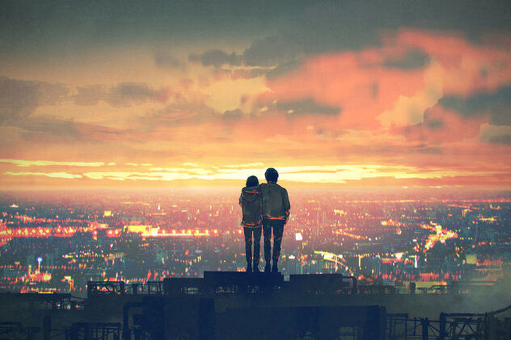 Young,Couple,Standing,On,The,Roof,Top,Looking,At,Cityscape