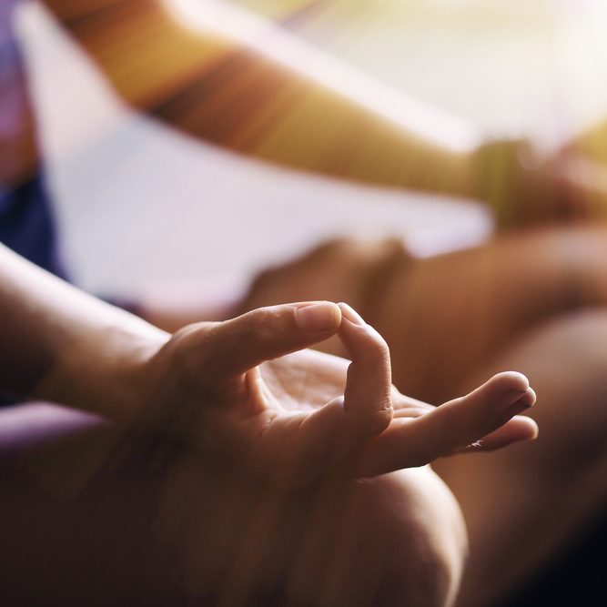 Closeup,Of,Woman's,Hands,Meditating,Indoors