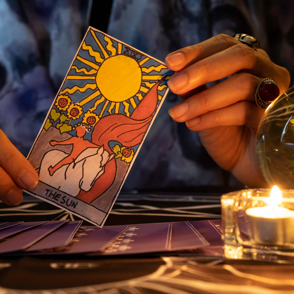 Fortune,Teller,Of,Hands,Holding,The,Sun,Card,And,Tarot