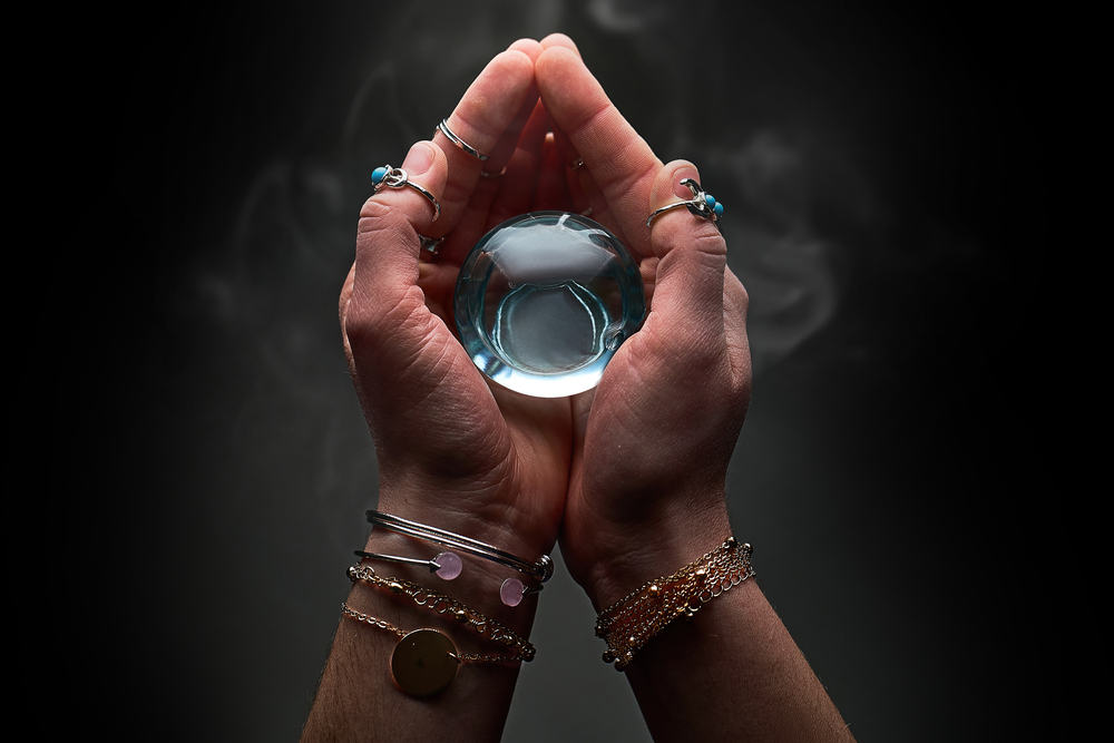 Magic,Blue,Crystal,Ball,With,Smoke,In,Hands,Of,Fortune