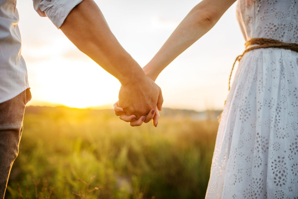 Couple holding hands